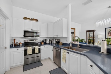 Rarely available single-story courtyard home perfectly situated on The President Country Club in Florida - for sale on GolfHomes.com, golf home, golf lot