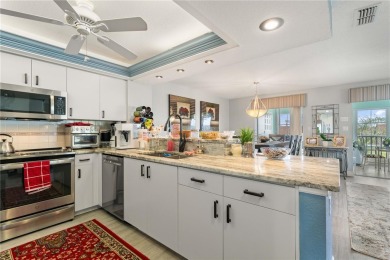 END-UNIT CONDO IN PGI W/UPDATED INTERIOR  DIRECT SAILBOAT ACCESS on Saint Andrews South Golf Club in Florida - for sale on GolfHomes.com, golf home, golf lot
