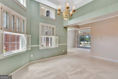 This bright, sunlit gem is situated overlooking a beautiful lake on Braelinn Golf Club in Georgia - for sale on GolfHomes.com, golf home, golf lot