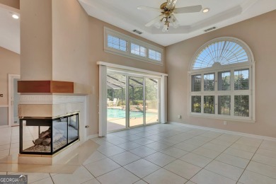 This bright, sunlit gem is situated overlooking a beautiful lake on Braelinn Golf Club in Georgia - for sale on GolfHomes.com, golf home, golf lot