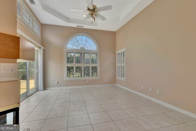 This bright, sunlit gem is situated overlooking a beautiful lake on Braelinn Golf Club in Georgia - for sale on GolfHomes.com, golf home, golf lot