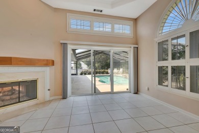 This bright, sunlit gem is situated overlooking a beautiful lake on Braelinn Golf Club in Georgia - for sale on GolfHomes.com, golf home, golf lot