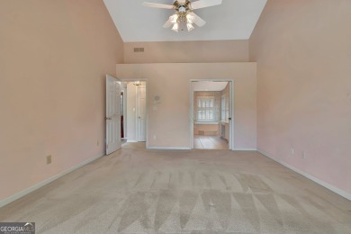 This bright, sunlit gem is situated overlooking a beautiful lake on Braelinn Golf Club in Georgia - for sale on GolfHomes.com, golf home, golf lot