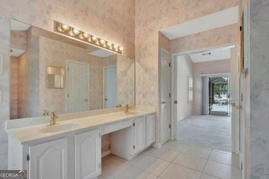 This bright, sunlit gem is situated overlooking a beautiful lake on Braelinn Golf Club in Georgia - for sale on GolfHomes.com, golf home, golf lot