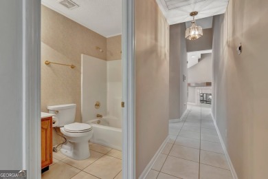 This bright, sunlit gem is situated overlooking a beautiful lake on Braelinn Golf Club in Georgia - for sale on GolfHomes.com, golf home, golf lot