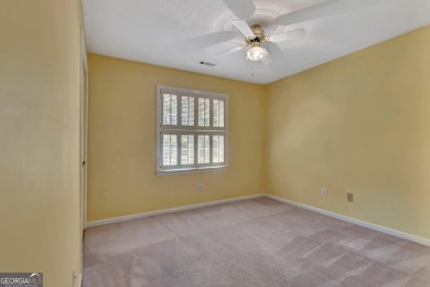 This bright, sunlit gem is situated overlooking a beautiful lake on Braelinn Golf Club in Georgia - for sale on GolfHomes.com, golf home, golf lot