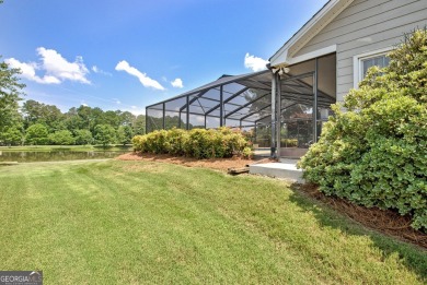 This bright, sunlit gem is situated overlooking a beautiful lake on Braelinn Golf Club in Georgia - for sale on GolfHomes.com, golf home, golf lot