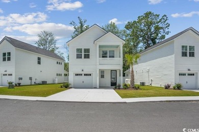 Fall in love with this 3-bedroom, 2.5-bath home with a spacious on Tidewater Golf Club and Plantation in South Carolina - for sale on GolfHomes.com, golf home, golf lot