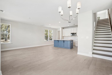 Fall in love with this 3-bedroom, 2.5-bath home with a spacious on Tidewater Golf Club and Plantation in South Carolina - for sale on GolfHomes.com, golf home, golf lot