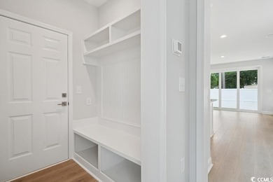 Fall in love with this 3-bedroom, 2.5-bath home with a spacious on Tidewater Golf Club and Plantation in South Carolina - for sale on GolfHomes.com, golf home, golf lot