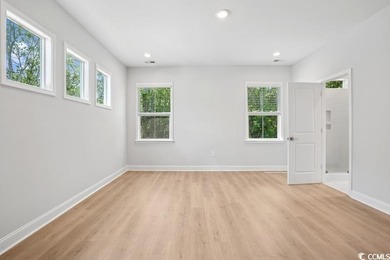 Fall in love with this 3-bedroom, 2.5-bath home with a spacious on Tidewater Golf Club and Plantation in South Carolina - for sale on GolfHomes.com, golf home, golf lot