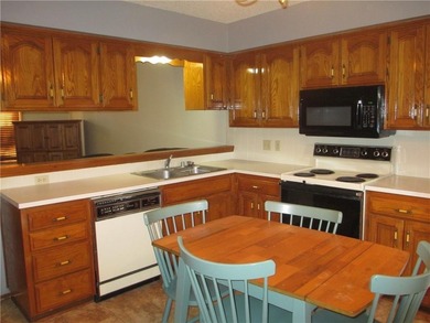 A place to stay and a place to play.  This condo offers either on Holiday Island Executive Golf Course in Arkansas - for sale on GolfHomes.com, golf home, golf lot