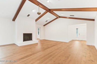 Timeless and inviting, this all-brick, one-level home is nestled on The Deerwood Country Club in Florida - for sale on GolfHomes.com, golf home, golf lot