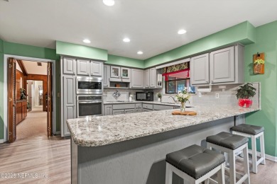 Timeless and inviting, this all-brick, one-level home is nestled on The Deerwood Country Club in Florida - for sale on GolfHomes.com, golf home, golf lot