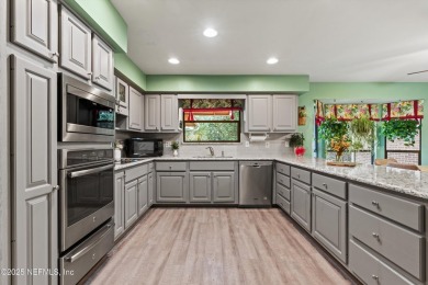 Timeless and inviting, this all-brick, one-level home is nestled on The Deerwood Country Club in Florida - for sale on GolfHomes.com, golf home, golf lot