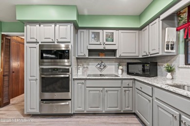 Timeless and inviting, this all-brick, one-level home is nestled on The Deerwood Country Club in Florida - for sale on GolfHomes.com, golf home, golf lot