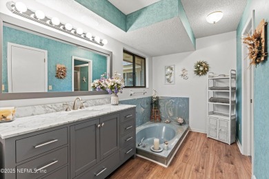 Timeless and inviting, this all-brick, one-level home is nestled on The Deerwood Country Club in Florida - for sale on GolfHomes.com, golf home, golf lot