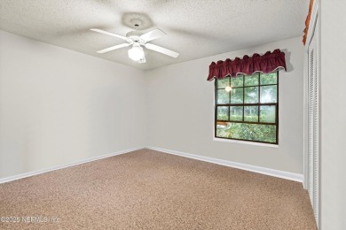 Timeless and inviting, this all-brick, one-level home is nestled on The Deerwood Country Club in Florida - for sale on GolfHomes.com, golf home, golf lot