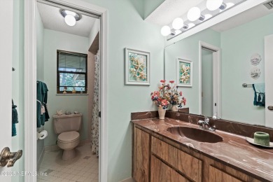 Timeless and inviting, this all-brick, one-level home is nestled on The Deerwood Country Club in Florida - for sale on GolfHomes.com, golf home, golf lot