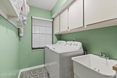 Timeless and inviting, this all-brick, one-level home is nestled on The Deerwood Country Club in Florida - for sale on GolfHomes.com, golf home, golf lot