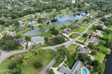 Timeless and inviting, this all-brick, one-level home is nestled on The Deerwood Country Club in Florida - for sale on GolfHomes.com, golf home, golf lot