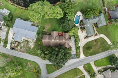 Timeless and inviting, this all-brick, one-level home is nestled on The Deerwood Country Club in Florida - for sale on GolfHomes.com, golf home, golf lot