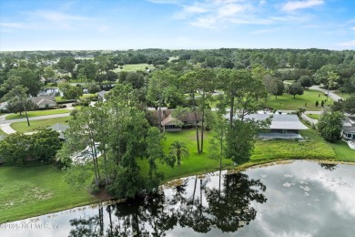 Timeless and inviting, this all-brick, one-level home is nestled on The Deerwood Country Club in Florida - for sale on GolfHomes.com, golf home, golf lot