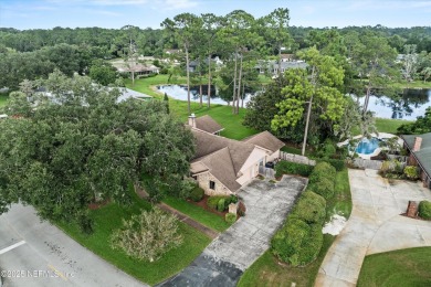Timeless and inviting, this all-brick, one-level home is nestled on The Deerwood Country Club in Florida - for sale on GolfHomes.com, golf home, golf lot