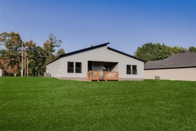 Welcome to your dream home! This modern new construction home on Bella Vista Country Club - Highlands in Arkansas - for sale on GolfHomes.com, golf home, golf lot