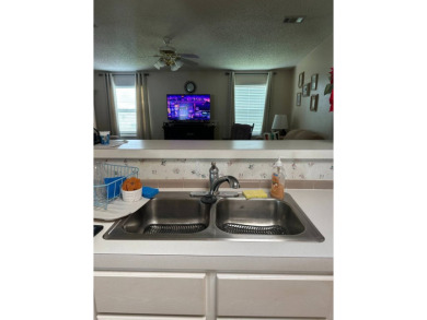 Charming 2-Bedroom Home with Sunroom in a Wonderful on Schalamar Creek Golf and Country Club in Florida - for sale on GolfHomes.com, golf home, golf lot