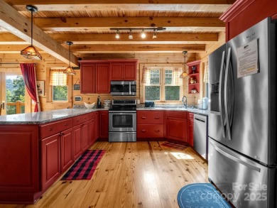 Classic log cabin, conveniently located behind the gates of on Rumbling Bald Resort on Lake Lure in North Carolina - for sale on GolfHomes.com, golf home, golf lot