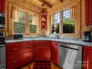 Classic log cabin, conveniently located behind the gates of on Rumbling Bald Resort on Lake Lure in North Carolina - for sale on GolfHomes.com, golf home, golf lot