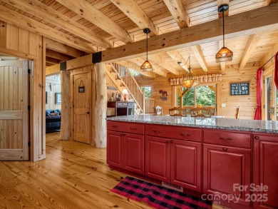 Classic log cabin, conveniently located behind the gates of on Rumbling Bald Resort on Lake Lure in North Carolina - for sale on GolfHomes.com, golf home, golf lot