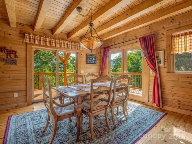 Classic log cabin, conveniently located behind the gates of on Rumbling Bald Resort on Lake Lure in North Carolina - for sale on GolfHomes.com, golf home, golf lot