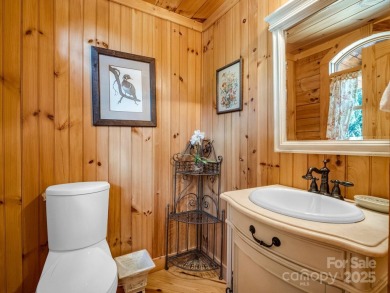 Classic log cabin, conveniently located behind the gates of on Rumbling Bald Resort on Lake Lure in North Carolina - for sale on GolfHomes.com, golf home, golf lot