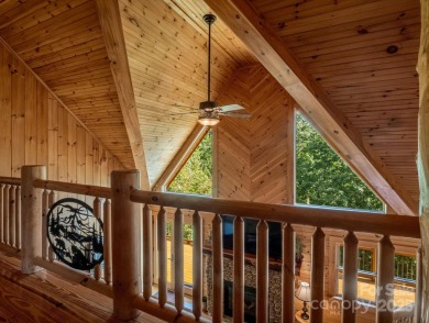 Classic log cabin, conveniently located behind the gates of on Rumbling Bald Resort on Lake Lure in North Carolina - for sale on GolfHomes.com, golf home, golf lot