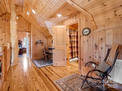 Classic log cabin, conveniently located behind the gates of on Rumbling Bald Resort on Lake Lure in North Carolina - for sale on GolfHomes.com, golf home, golf lot