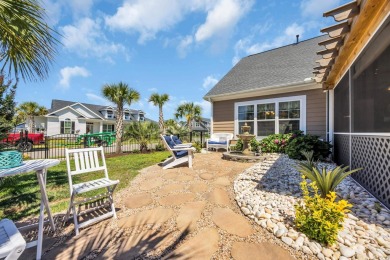 Relax on the welcoming front porch and soak up the sunshine in on Surf Golf and Beach Club in South Carolina - for sale on GolfHomes.com, golf home, golf lot