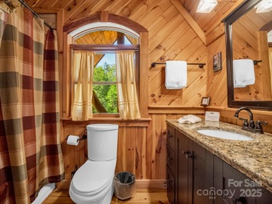 Classic log cabin, conveniently located behind the gates of on Rumbling Bald Resort on Lake Lure in North Carolina - for sale on GolfHomes.com, golf home, golf lot