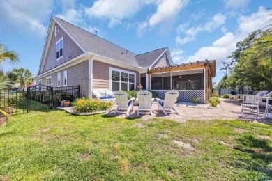 Relax on the welcoming front porch and soak up the sunshine in on Surf Golf and Beach Club in South Carolina - for sale on GolfHomes.com, golf home, golf lot