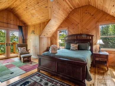 Classic log cabin, conveniently located behind the gates of on Rumbling Bald Resort on Lake Lure in North Carolina - for sale on GolfHomes.com, golf home, golf lot