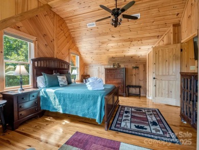 Classic log cabin, conveniently located behind the gates of on Rumbling Bald Resort on Lake Lure in North Carolina - for sale on GolfHomes.com, golf home, golf lot