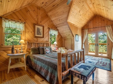 Classic log cabin, conveniently located behind the gates of on Rumbling Bald Resort on Lake Lure in North Carolina - for sale on GolfHomes.com, golf home, golf lot