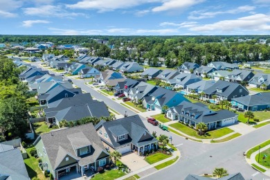 Relax on the welcoming front porch and soak up the sunshine in on Surf Golf and Beach Club in South Carolina - for sale on GolfHomes.com, golf home, golf lot