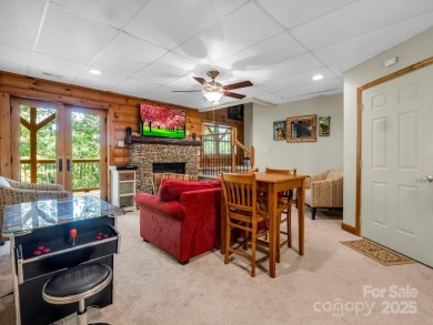 Classic log cabin, conveniently located behind the gates of on Rumbling Bald Resort on Lake Lure in North Carolina - for sale on GolfHomes.com, golf home, golf lot
