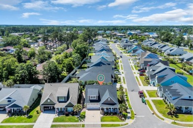Relax on the welcoming front porch and soak up the sunshine in on Surf Golf and Beach Club in South Carolina - for sale on GolfHomes.com, golf home, golf lot