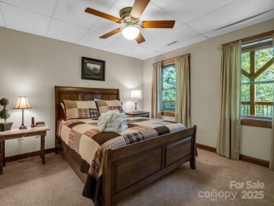 Classic log cabin, conveniently located behind the gates of on Rumbling Bald Resort on Lake Lure in North Carolina - for sale on GolfHomes.com, golf home, golf lot