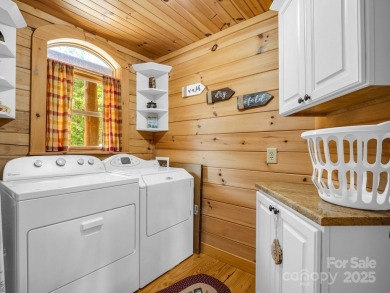 Classic log cabin, conveniently located behind the gates of on Rumbling Bald Resort on Lake Lure in North Carolina - for sale on GolfHomes.com, golf home, golf lot