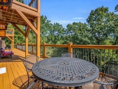 Classic log cabin, conveniently located behind the gates of on Rumbling Bald Resort on Lake Lure in North Carolina - for sale on GolfHomes.com, golf home, golf lot