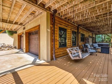Classic log cabin, conveniently located behind the gates of on Rumbling Bald Resort on Lake Lure in North Carolina - for sale on GolfHomes.com, golf home, golf lot